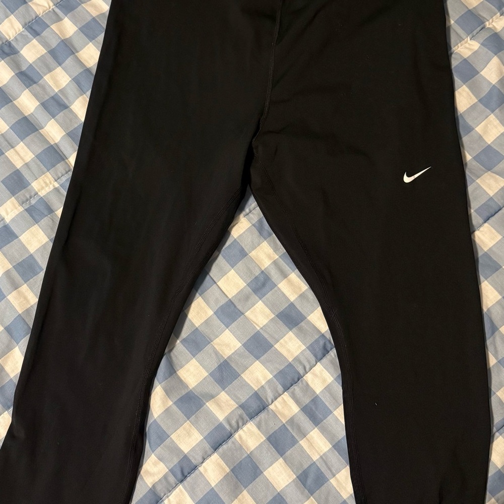 Nike women’s Dark Leggings with White Logo. Hot green waist band